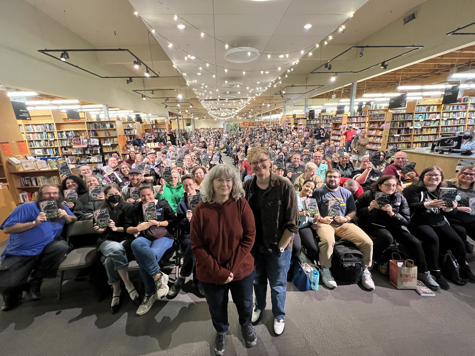 Me and Martha standing in front of a packed house at Powell's.